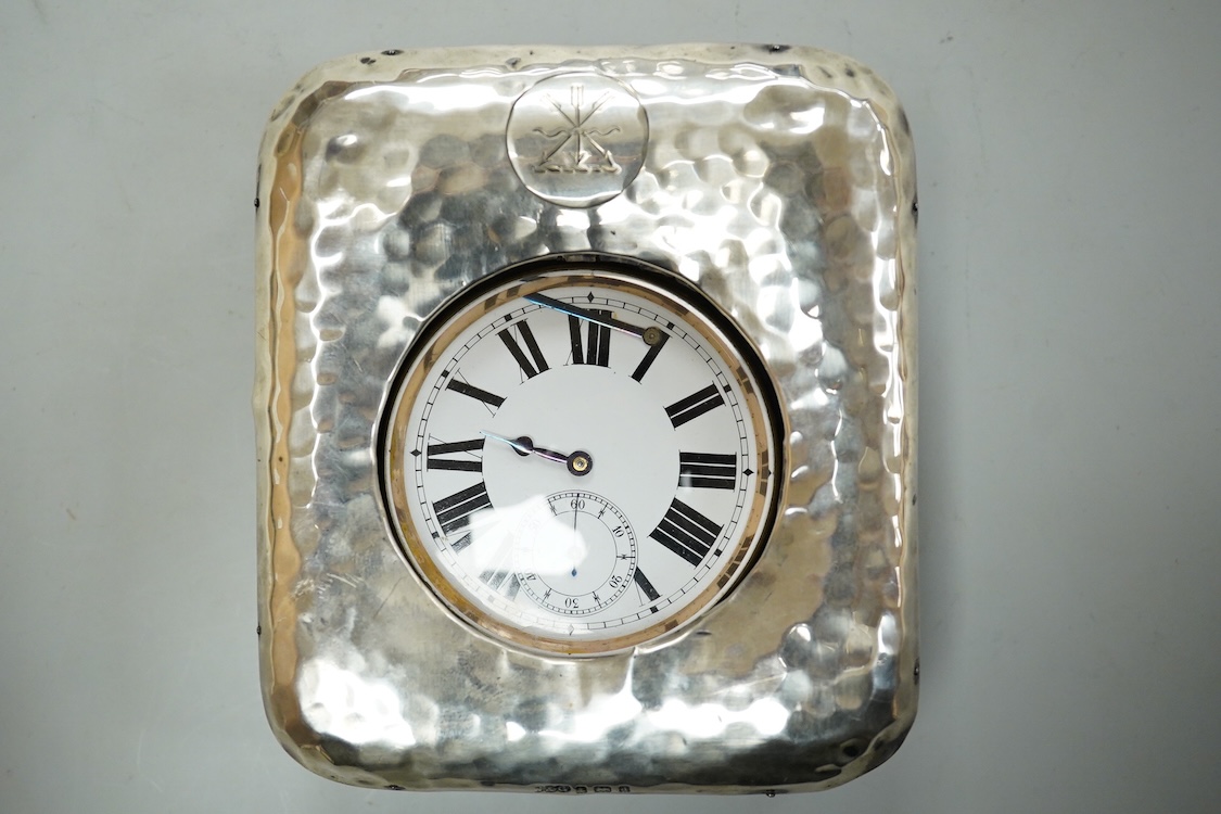 An Edwardian hammered silver mounted travelling pocket watch case, Wilson & Gill, Birmingham, 1903, containing a nickel cased pocket watch.